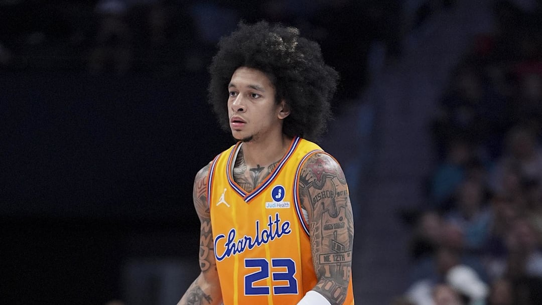 Feb 19, 2026; Charlotte, North Carolina, USA;Charlotte Hornets guard Tre Mann (23) brings the ball up court against the Houston Rockets during the second  quarter at Spectrum Center. Mandatory Credit: Jim Dedmon-Imagn Images