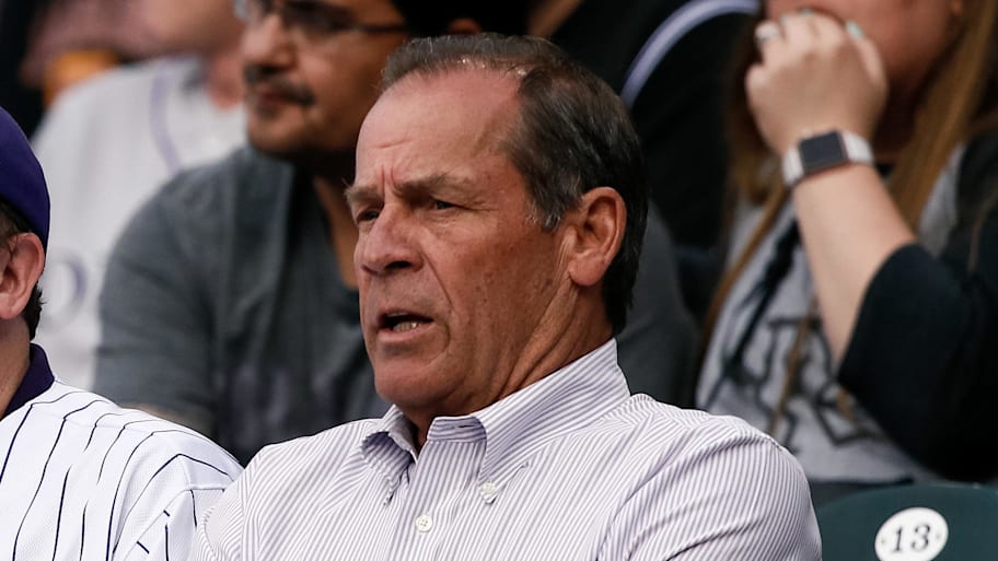 Colorado governor Jared Polis (L) sits with Colorado Rockies owner Dick Monfort