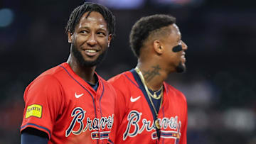 Sep 26, 2025; Cumberland, Georgia, USA; Atlanta Braves outfielder Jurickson Profar (7) and outfielder Ronald Acuna Jr. (13) smile during the game against the Pittsburgh Pirates during the fourth inning at Truist Park.