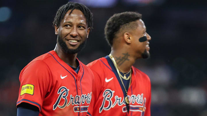 Sep 26, 2025; Cumberland, Georgia, USA; Atlanta Braves outfielder Jurickson Profar (7) and outfielder Ronald Acuna Jr. (13) smile during the game against the Pittsburgh Pirates during the fourth inning at Truist Park.