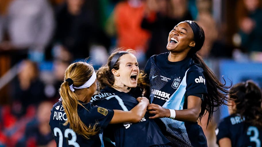 Gotham FC midfielder Rose Lavelle is congratulated by forward Midge Purce and midfielder Jaedyn Shaw.