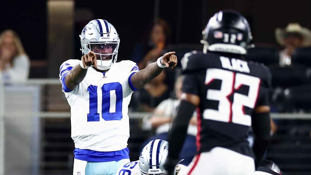 Aug 22, 2025; Arlington, Texas, USA;  Dallas Cowboys quarterback Joe Milton III (10) points at Atlanta Falcons safety Henry Black (32) during the first half at AT&T Stadium. Mandatory Credit: Kevin Jairaj-Imagn Images