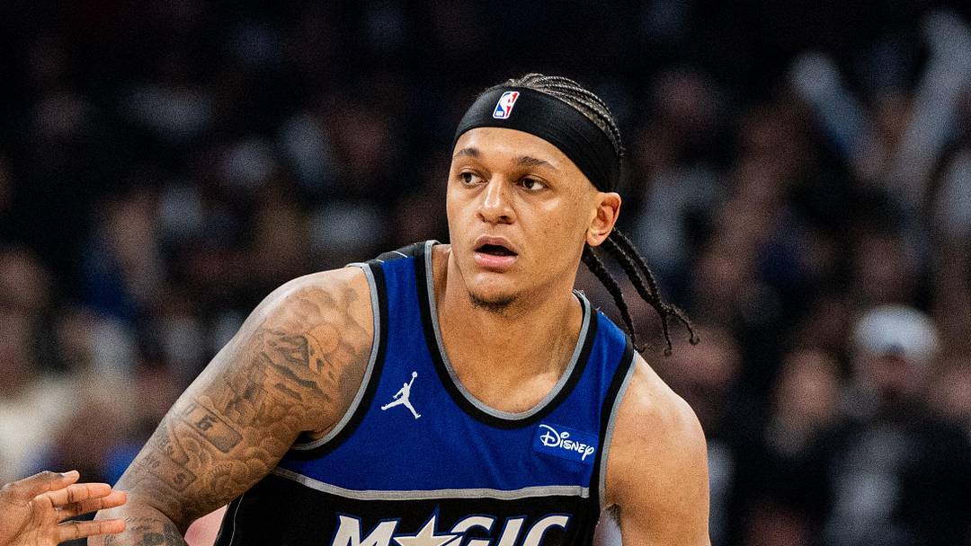 Orlando Magic forward Paolo Banchero dribbles the ball against Detroit Pistons forward Paul Reed. Orlando Magic forward Paolo Banchero dribbles the ball against Detroit Pistons forward Paul Reed.