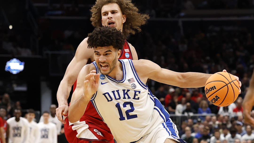 Mar 27, 2026; Washington, DC, USA; Duke Blue Devils forward Cameron Boozer (12) dribbles the ball past St. John's Red Storm forward Ruben Prey (17) in the second half during a Sweet Sixteen game of the East Regional of the men's 2026 NCAA Tournament at Capital One Arena. Mandatory Credit: Geoff Burke-Imagn Images
