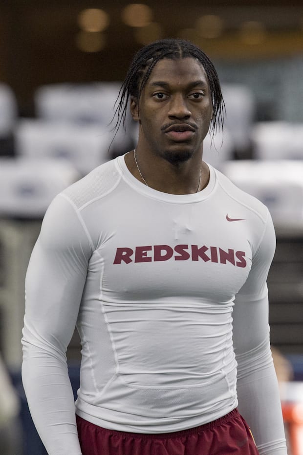 Washington Redskins quarterback Robert Griffin III warms before the game against the Dallas Cowboys Washington Redskins quarterback Robert Griffin III warms before the game against the Dallas Cowboys
