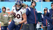 Nov 13, 2022; Nashville, Tennessee, USA; Denver Broncos tight end Greg Dulcich (80) is tackled by Tennessee Titans safety Joshua Kalu (28) during the fourth quarter at Nissan Stadium. Mandatory Credit: George Walker IV-USA TODAY Sports