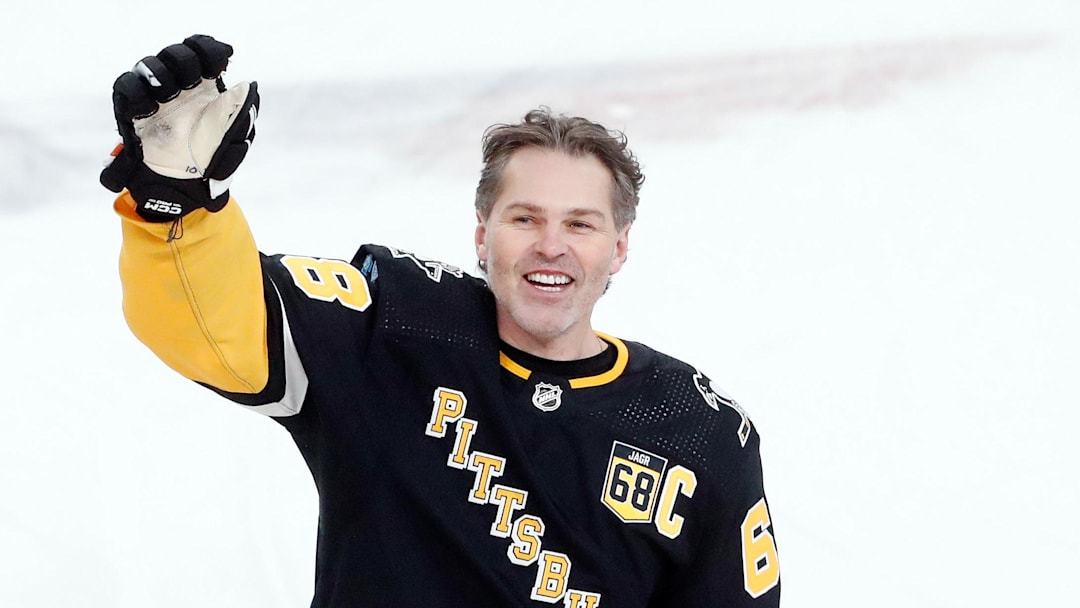 Feb 18, 2024; Pittsburgh, Pennsylvania, USA;  Pittsburgh Penguins former right wing Jaromir Jagr (68) waves to the crowd at the conclusion of warm-ups against the Los Angeles Kings at PPG Paints Arena. Mandatory Credit: Charles LeClaire-Imagn Images