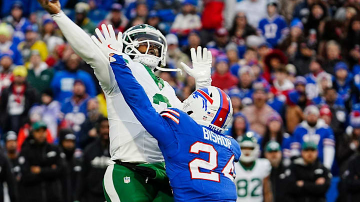 New York Jets quarterback Tyrod Taylor (2) feels the pressure from Buffalo Bills safety Cole Bishop (24) New York Jets quarterback Tyrod Taylor (2) feels the pressure from Buffalo Bills safety Cole Bishop (24)