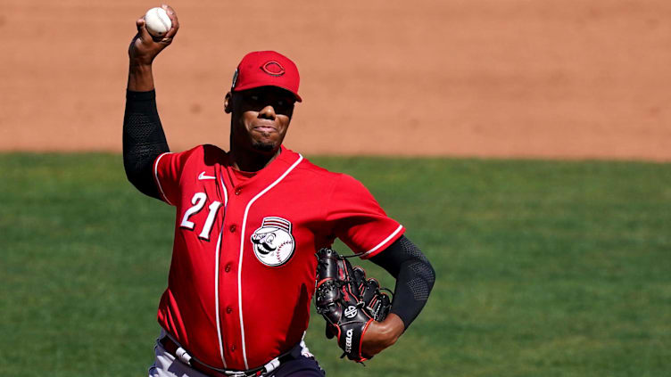 Cincinnati Reds pitcher Hunter Greene (21) delivers during a spring training game.