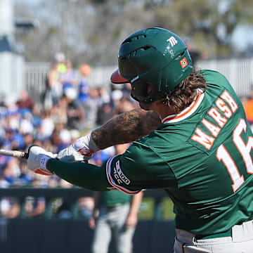 Miami's Bobby Marsh hitting the ball against Florida and bring in more RBIs on the season