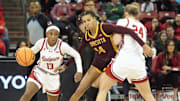 Wisconsin point guard Ronnie Porter (13) works around a screen set by Natalie Leuzinger (24) as Minnesota's Tori McKinney defends during a game at the Kohl Center in Madison, Wisconsin on Tuesday Dec. 31, 2024.