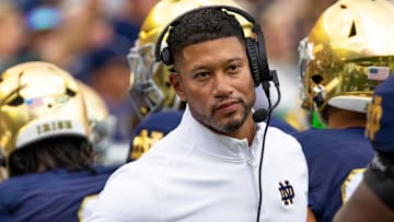 Sep 20, 2025; South Bend, Indiana, USA; Notre Dame Fighting Irish head coach Marcus Freeman high fives players after a touchdown against the Purdue Boilermakers during the first half at Notre Dame Stadium.