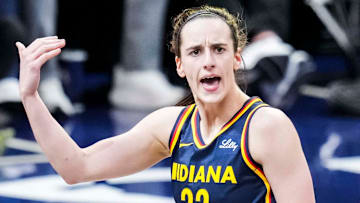 Indiana Fever guard Caitlin Clark celebrates after scoring a 3-pointer during a WNBA game against the Connecticut Sun