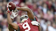 Nov 15, 2014; Tuscaloosa, AL, USA; Alabama Crimson Tide wide receiver Amari Cooper (9) catches a pass ahead of Mississippi State Bulldogs defensive back Kendrick Market (26) in the second quarter at Bryant-Denny Stadium. 
