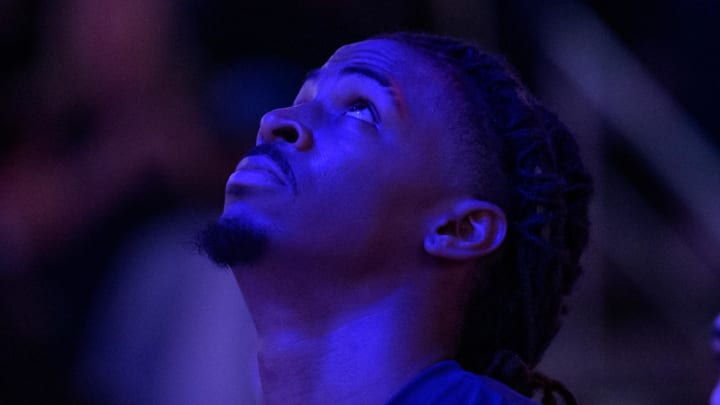 Dec 19, 2023; New Orleans, Louisiana, USA; Memphis Grizzlies guard Ja Morant (12) looks up during the national anthem before a game against the New Orleans Pelicans at the Smoothie King Center. 