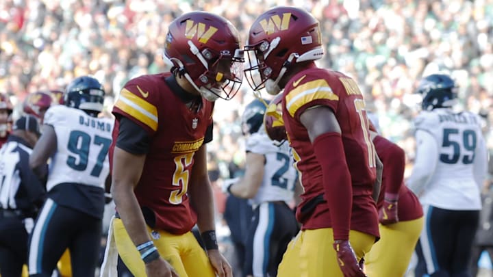 Washington Commanders quarterback Jayden Daniels (5) celebrates with Commanders wide receiver Terry McLaurin (17s Washington Commanders quarterback Jayden Daniels (5) celebrates with Commanders wide receiver Terry McLaurin (17s