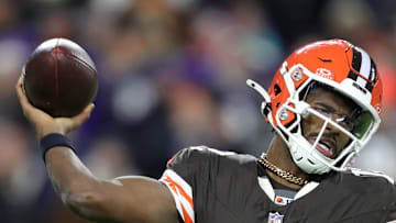 Cleveland Browns quarterback Shedeur Sanders is hit by Baltimore Ravens linebacker Trenton Simpson.