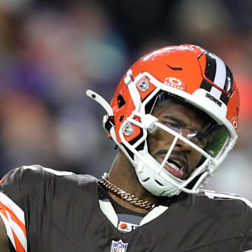 Cleveland Browns quarterback Shedeur Sanders is hit by Baltimore Ravens linebacker Trenton Simpson.