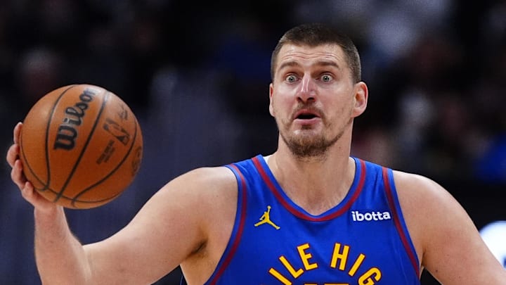 Feb 9, 2026; Denver, Colorado, USA; Denver Nuggets center Nikola Jokic (15) reacts in the second quarter against the Cleveland Cavaliers at Ball Arena. Mandatory Credit: Ron Chenoy-Imagn Images