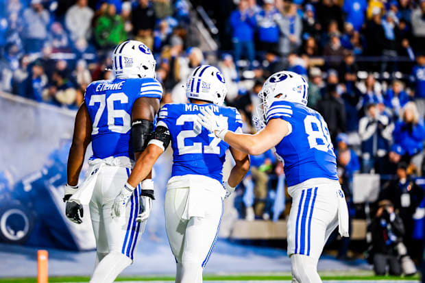 BYU left tackle Caleb Etienne and running back LJ Martin against Oklahoma State