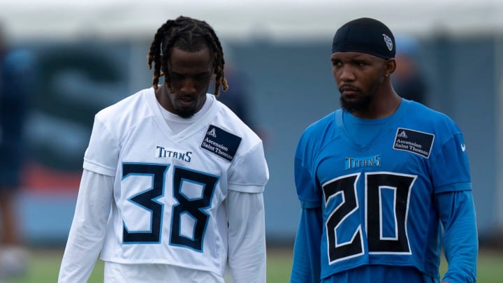 Tennessee Titans L'Jarius Sneed (38) and Tony Pollard (20) cross paths after practice on the second day of training camp Thursday, July 25, 2024. It is hoped the two new acquisitions will be impact players for the team this year.