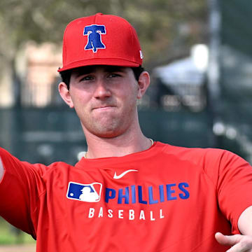 Feb 12, 2025; Clearwater, FL, USA; Philadelphia Phillies pitcher Andrew Painter (76) throws a football during a spring training workout at Carpenter Complex.