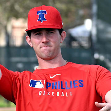 Feb 12, 2025; Clearwater, FL, USA; Philadelphia Phillies pitcher Andrew Painter (76) throws a football during a spring training workout at Carpenter Complex