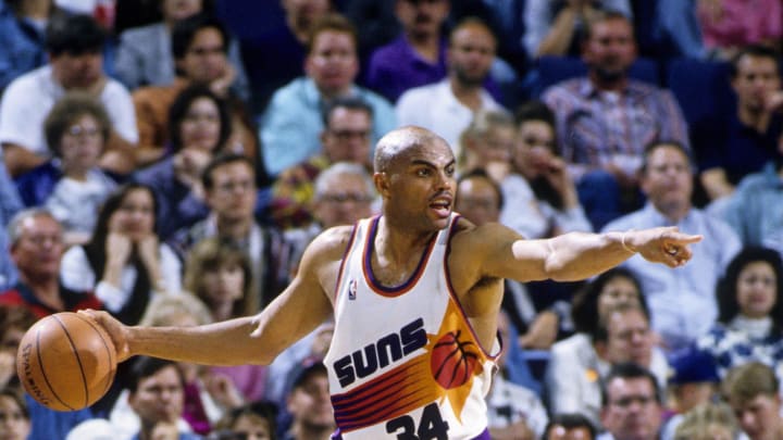 Unknown date 1996; Phoenix, AZ, USA; FILE PHOTO; Phoenix Suns forward Charles Barkley (34) is defended by Seattle Supersonics forward Detlef Schrempf (11) at America West Arena. Mandatory Credit: USA TODAY Sports