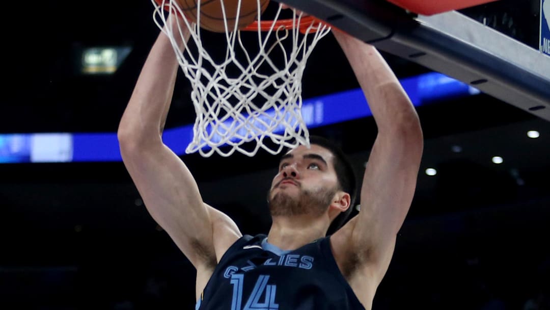 Dec 7, 2025; Memphis, Tennessee, USA; Memphis Grizzlies center Zach Edey (14) dunks during the fourth quarter against the Portland Trail Blazers at FedExForum. Mandatory Credit: Petre Thomas-Imagn Images