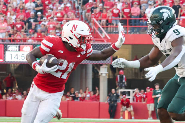 Emmett Johnson picks up a first down on a five-yard catch early in the fourth quarter against Michigan State on Oct. 4, 2025.