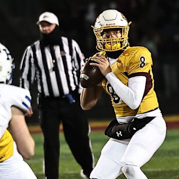 Cooper quarterback Cam O'Hara drops back to pass during Cooper's state semifinal win over Highlands Friday, Nov 29, 2024.