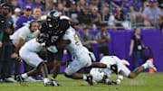 Oct 4, 2025; Fort Worth, Texas, USA; TCU Horned Frogs running back Trent Battle (6) is tackled by Colorado Buffaloes defensive back Teon Parks (3) and linebacker Reginald Hughes (50) during the first half at Amon G. Carter Stadium. Mandatory Credit: Raymond Carlin III-Imagn Images