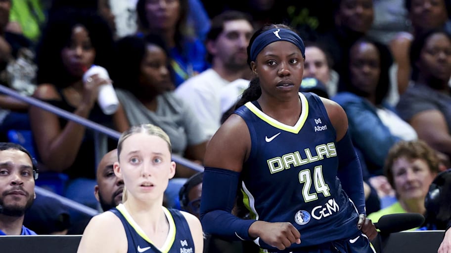 Dallas Wings guard Paige Bueckers and Dallas Wings guard Arike Ogunbowale wait to enter a game on the sidelines. | Kevin Jairaj-Imagn Images