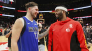 Jan 26, 2024; Atlanta, Georgia, USA; Dallas Mavericks guard Luka Doncic (77) talks to Atlanta Hawks guard Wesley Matthews (32) in the second half at State Farm Arena. Mandatory Credit: Brett Davis-USA TODAY Sports