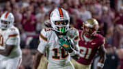 University of Miami wide receiver Malachi Toney (10) runs after catching a pass from quarterback Carson Beck (11).
