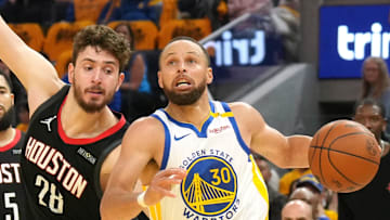 Apr 26, 2025; San Francisco, California, USA; Golden State Warriors guard Stephen Curry (30) dribbles against Houston Rockets center Alperen Sengun (28) during the second quarter of game three of first round for the 2024 NBA Playoffs at Chase Center. Mandatory Credit: Darren Yamashita-Imagn Images