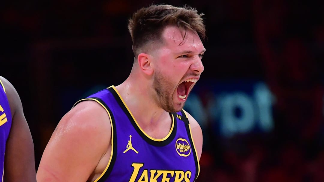 Feb 25, 2025; Los Angeles, California, USA; Los Angeles Lakers guard Luka Doncic (77) reacts against the Dallas Mavericks during the first quarter at Crypto.com Arena. Mandatory Credit: Gary A. Vasquez-Imagn Images