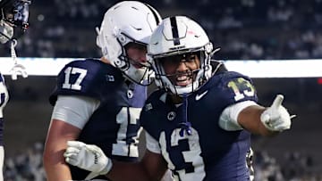 Nov 22, 2025; University Park, Pennsylvania, USA; Penn State Nittany Lions running back Kaytron Allen (13) celebrates with quarterback Ethan Grunkemeyer (17) after scoring a touchdown during the fourth quarter against the Nebraska Cornhuskers at Beaver Stadium. Mandatory Credit: Matthew O'Haren-Imagn Images