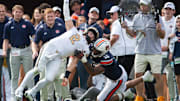 Vanderbilt Commodores quarterback Diego Pavia (2) throws the ball before he can be sacked by Auburn Tigers defensive lineman Keldric Faulk (15) as Auburn Tigers take on Vanderbilt Commodores at Jordan-Hare Stadium in Auburn, Ala., on Saturday, Nov. 2, 2024. Auburn Tigers and Vanderbilt Commodores are tied 7-7 at halftime.