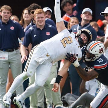 Vanderbilt Commodores quarterback Diego Pavia (2) throws the ball before he can be sacked by Auburn Tigers defensive lineman Keldric Faulk (15) as Auburn Tigers take on Vanderbilt Commodores at Jordan-Hare Stadium in Auburn, Ala., on Saturday, Nov. 2, 2024. Auburn Tigers and Vanderbilt Commodores are tied 7-7 at halftime.
