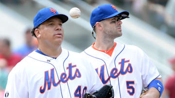Mets starting pitcher Bartolo Colon (40) gets pulled from the game in the 5th inning against the San Francisco Giants as New York Mets third baseman David Wright (5) waits on the manager at Citi Field on Aug. 3, 2014.
