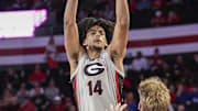 Feb 25, 2025; Athens, Georgia, USA; Georgia Bulldogs forward Asa Newell (14) shoots over Florida Gators forward Thomas Haugh (10) during the first half at Stegeman Coliseum. Mandatory Credit: Dale Zanine-Imagn Images