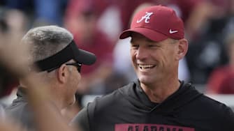Nov 22, 2025; Tuscaloosa, Alabama, USA;  Eastern Illinois head coach Chris Wilkerson and Alabama head coach Kalen DeBoer talk before the game at Saban Field at Bryant-Denny Stadium. Mandatory Credit: Gary Cosby Jr.-Imagn Images