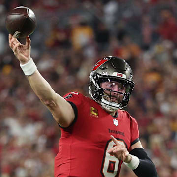 Jan 12, 2025; Tampa, Florida, USA; Tampa Bay Buccaneers quarterback Baker Mayfield (6) throws during the third quarter of a NFC wild card playoff against the Washington Commanders at Raymond James Stadium. Mandatory Credit: Nathan Ray Seebeck-Imagn Images