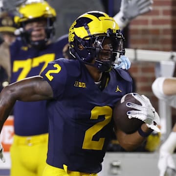 Aug 31, 2024; Ann Arbor, Michigan, USA;  Michigan Wolverines defensive back Will Johnson (2) runs the ball after he makes an interception in the second half against the Fresno State Bulldogs at Michigan Stadium. Mandatory Credit: Rick Osentoski-Imagn Images