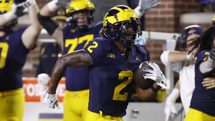 Aug 31, 2024; Ann Arbor, Michigan, USA;  Michigan Wolverines defensive back Will Johnson (2) runs the ball after he makes an interception in the second half against the Fresno State Bulldogs at Michigan Stadium.  