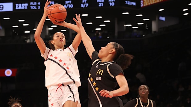 McDonald's All American West guard Jazzy Davidson (6) shoots the ball against McDonald's All American East wing Deniya Prawl.