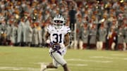 Nov 30, 2024; Ames, Iowa, USA; Kansas State Wildcats running back DJ Giddens (31) runs for a first down against the Iowa State Cyclones in the second quarter at at Jack Trice Stadium. Mandatory Credit: Reese Strickland-Imagn Images