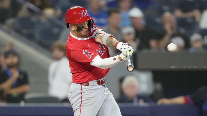 Aug 23, 2024; Toronto, Ontario, CAN; Los Angeles Angels shortstop Zach Neto (9) hits a single against the Toronto Blue Jays during the eighth inning at Rogers Centre.