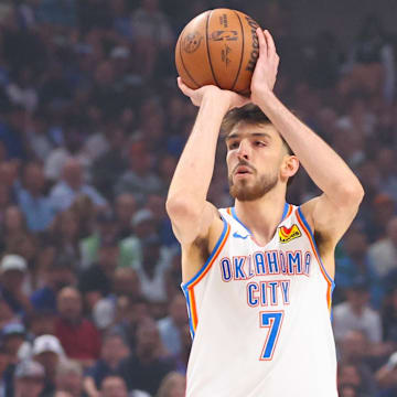 May 18, 2024; Dallas, Texas, USA; Oklahoma City Thunder forward Chet Holmgren (7) shoots as Dallas Mavericks guard Kyrie Irving (11) defends during the first quarter in game six of the second round of the 2024 NBA playoffs at American Airlines Center. Mandatory Credit: Kevin Jairaj-Imagn Images